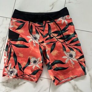 Volcom orange and floral patterned swim trunks